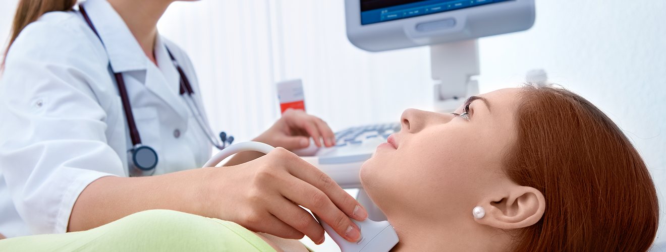 Sonographer performing a diagnostic ultrasound examination